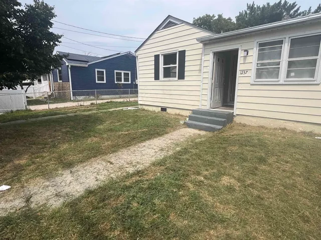 a view of balcony with wooden fence
