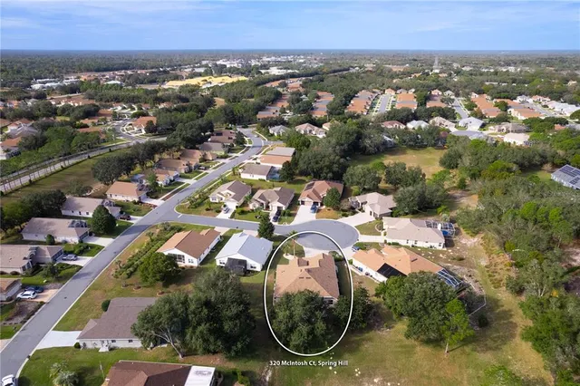 a kitchen with stainless steel appliances granite countertop a stove a refrigerator and a microwave