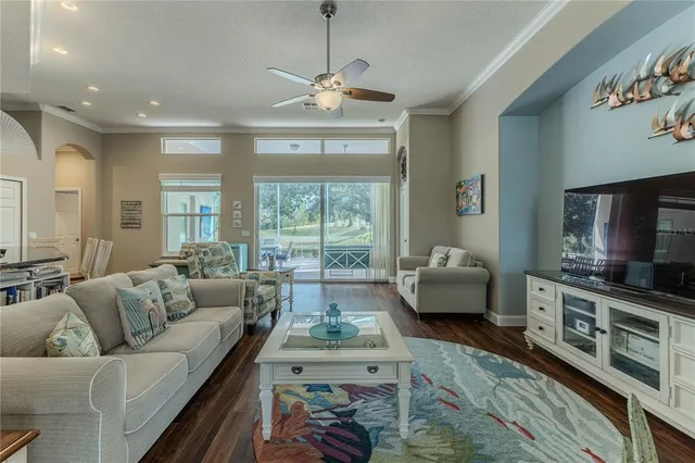 a kitchen with stainless steel appliances granite countertop white cabinets sink and a granite counter top
