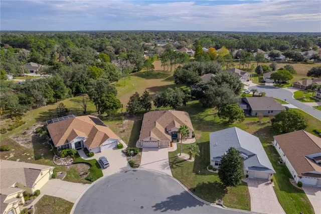 a bedroom with a bed and a lamp on wall