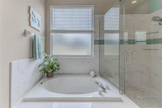 a view of storage and utility room with washer and dryer