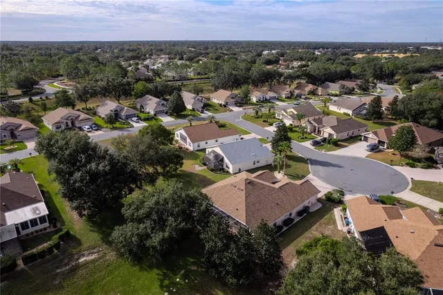 a view of a field with an trees
