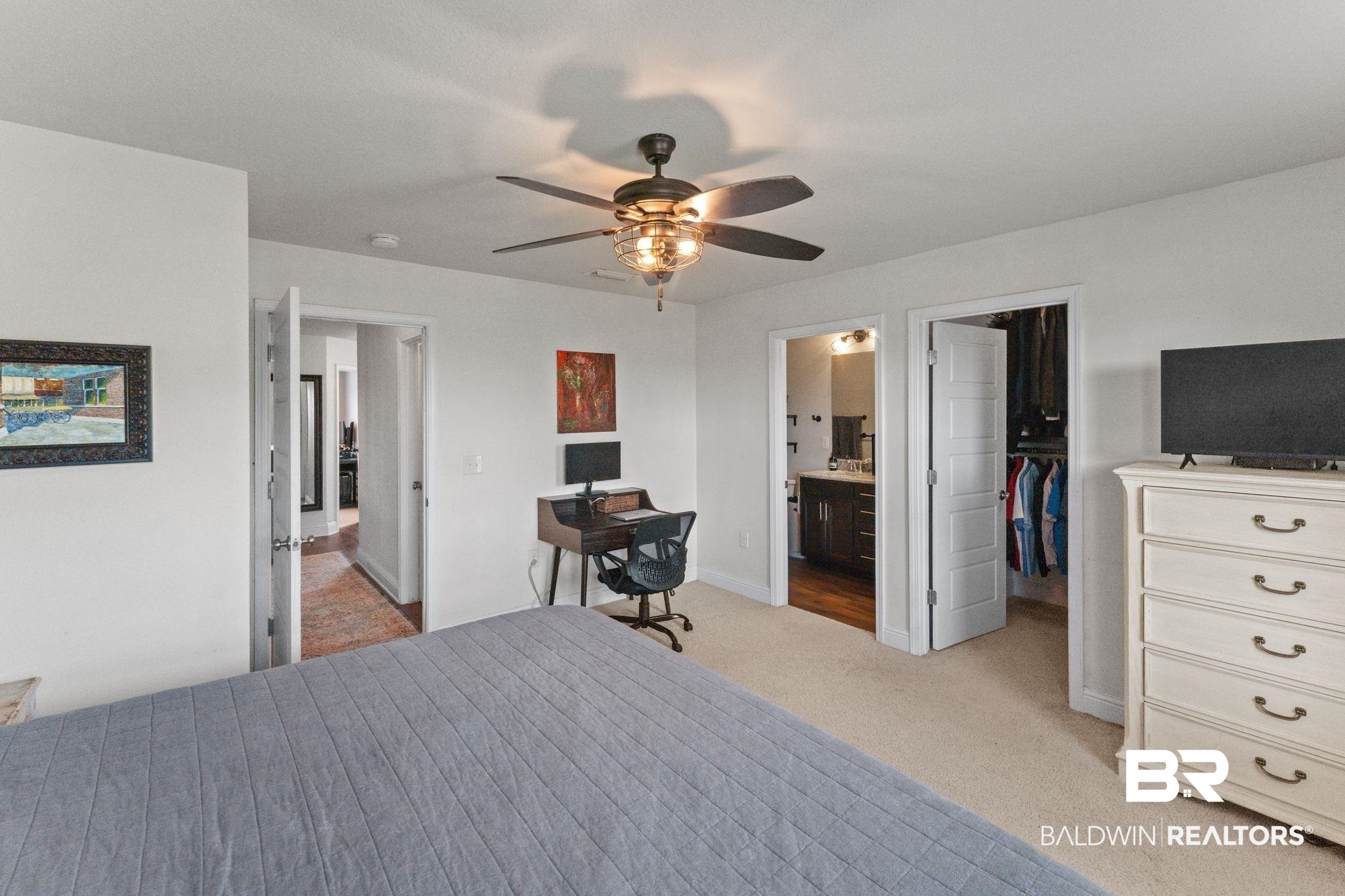 12711 Chickadee Lane Daphne, AL 36527 - Photo 19 of 39 Bedroom featuring a spacious closet, light colored carpet, ceiling fan, and a desk