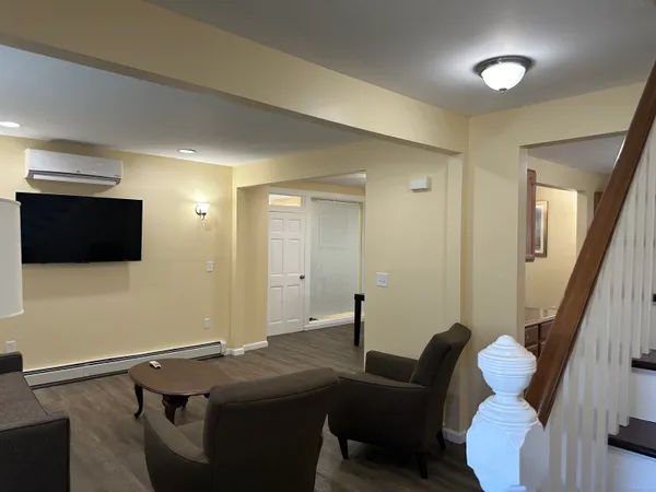 a room with furniture and a flat screen tv