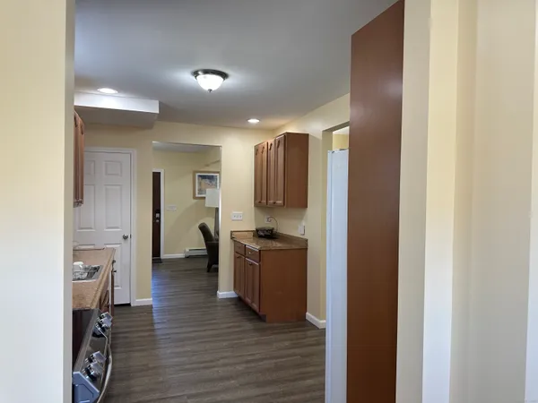 a view of a kitchen from the hallway