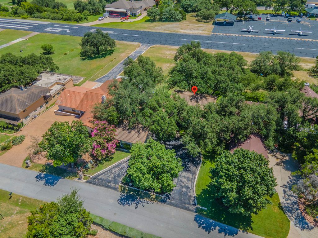 415 Dasher Drive Lakeway, TX 78734 - Photo 30 of 38 an aerial view of a house with a yard and garden