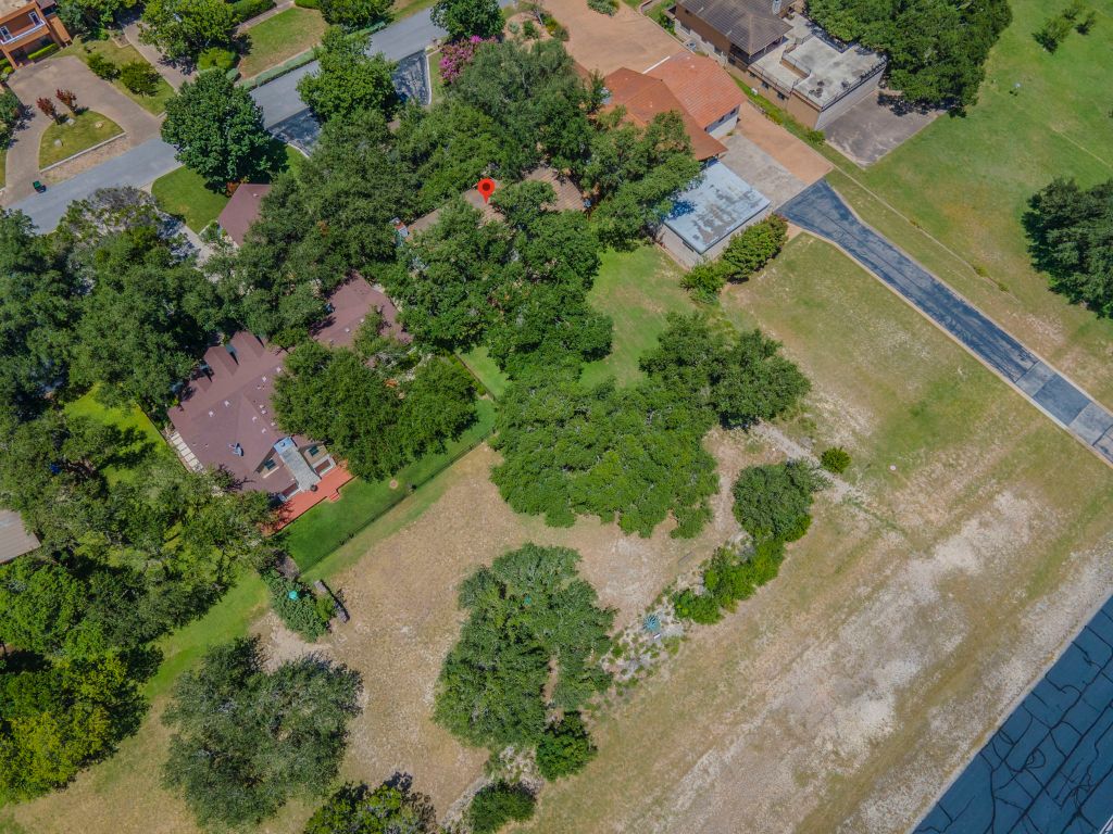 415 Dasher Drive Lakeway, TX 78734 - Photo 35 of 38 an aerial view of a house with a yard and lake view