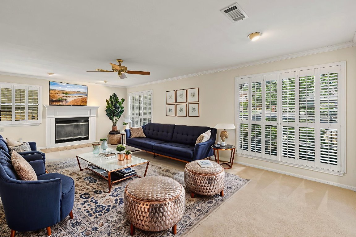 415 Dasher Drive Lakeway, TX 78734 - Photo 8 of 38 a living room with furniture and a fireplace