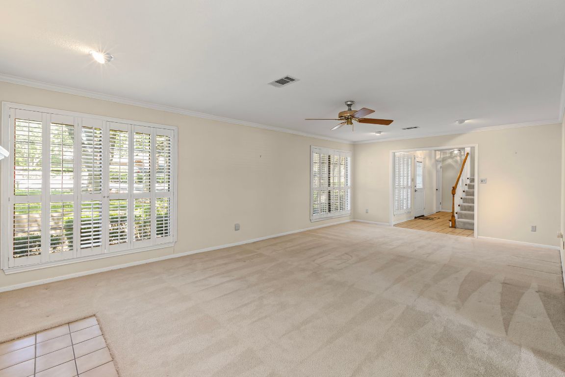 415 Dasher Drive Lakeway, TX 78734 - Photo 9 of 38 a view of an empty room with a window