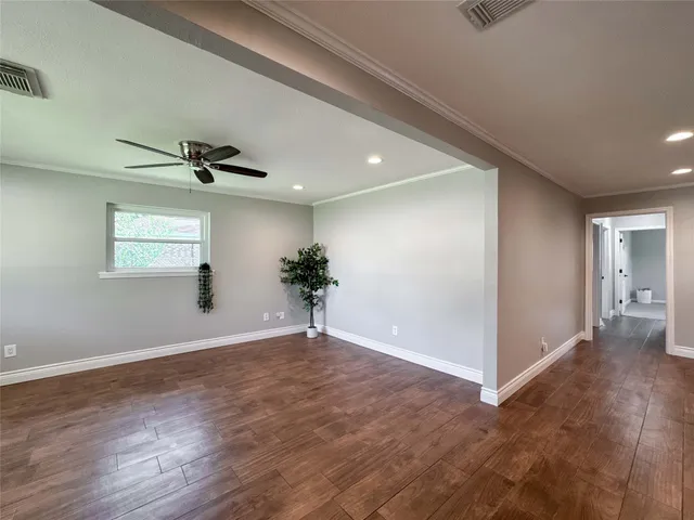 a view of an empty room with windows