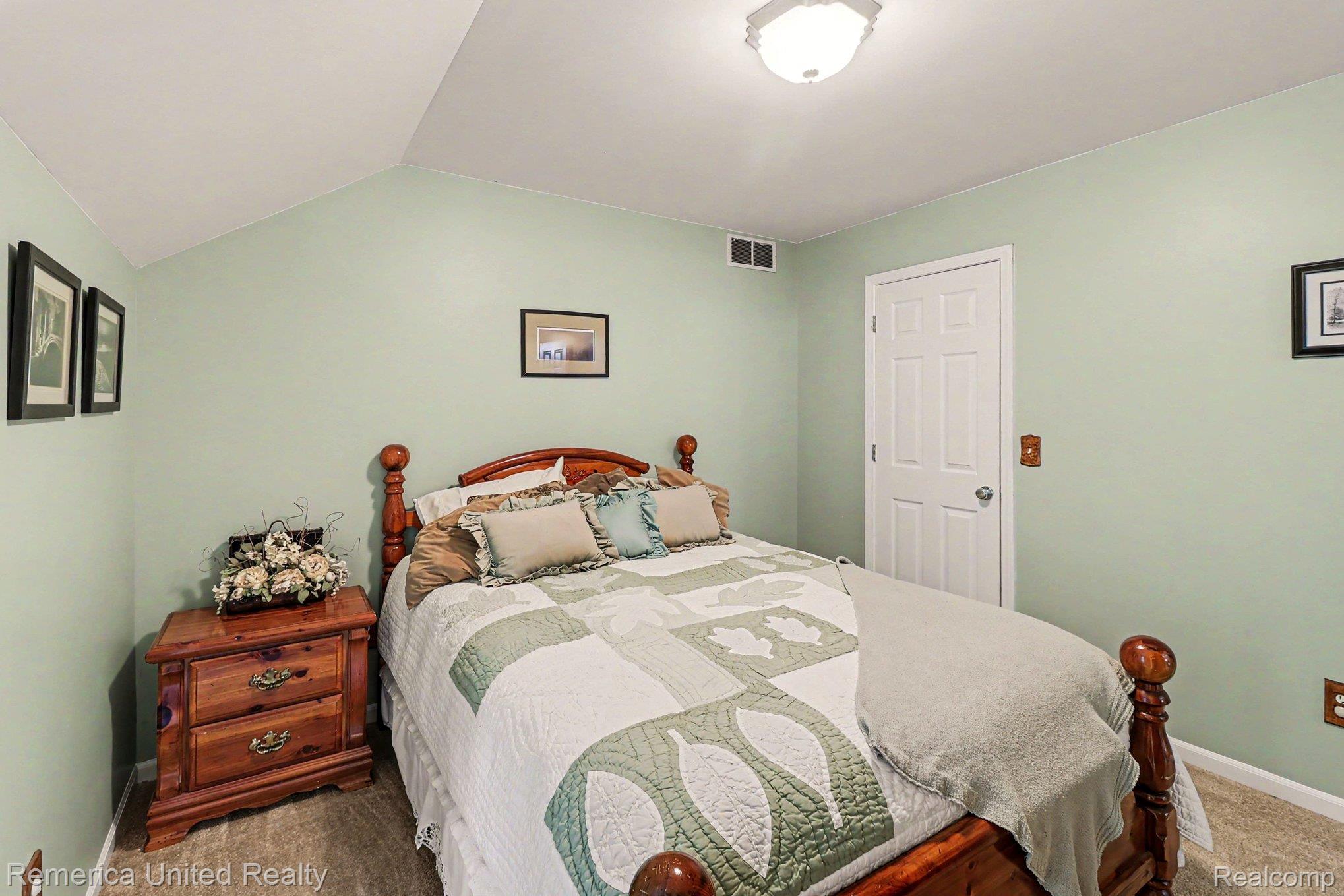 20962 Wasson Road Gregory, MI 48137 - Photo 23 of 39 Room featuring vaulted ceilings and light green wall paint