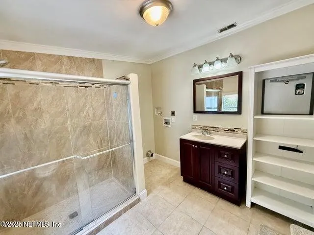 a bathroom with a tub a sink and mirror