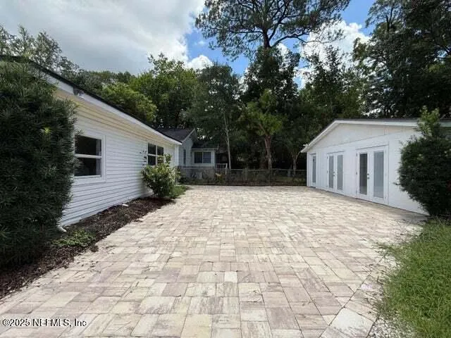 a house with trees in front of it