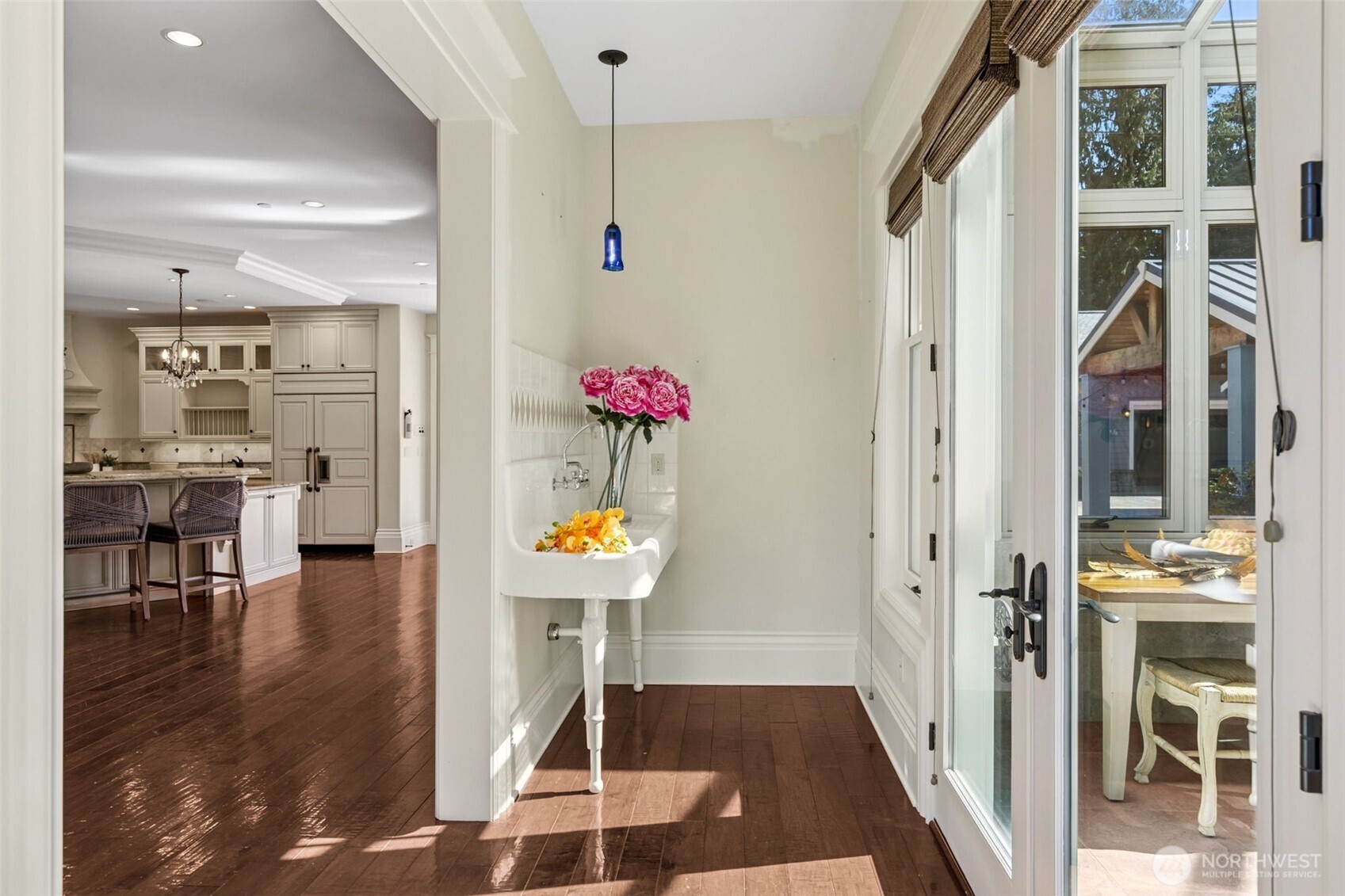 22029 238th Place Southeast Maple Valley, WA 98038 - Photo 13 of 40 a view of a hallway with dining room and wooden floor