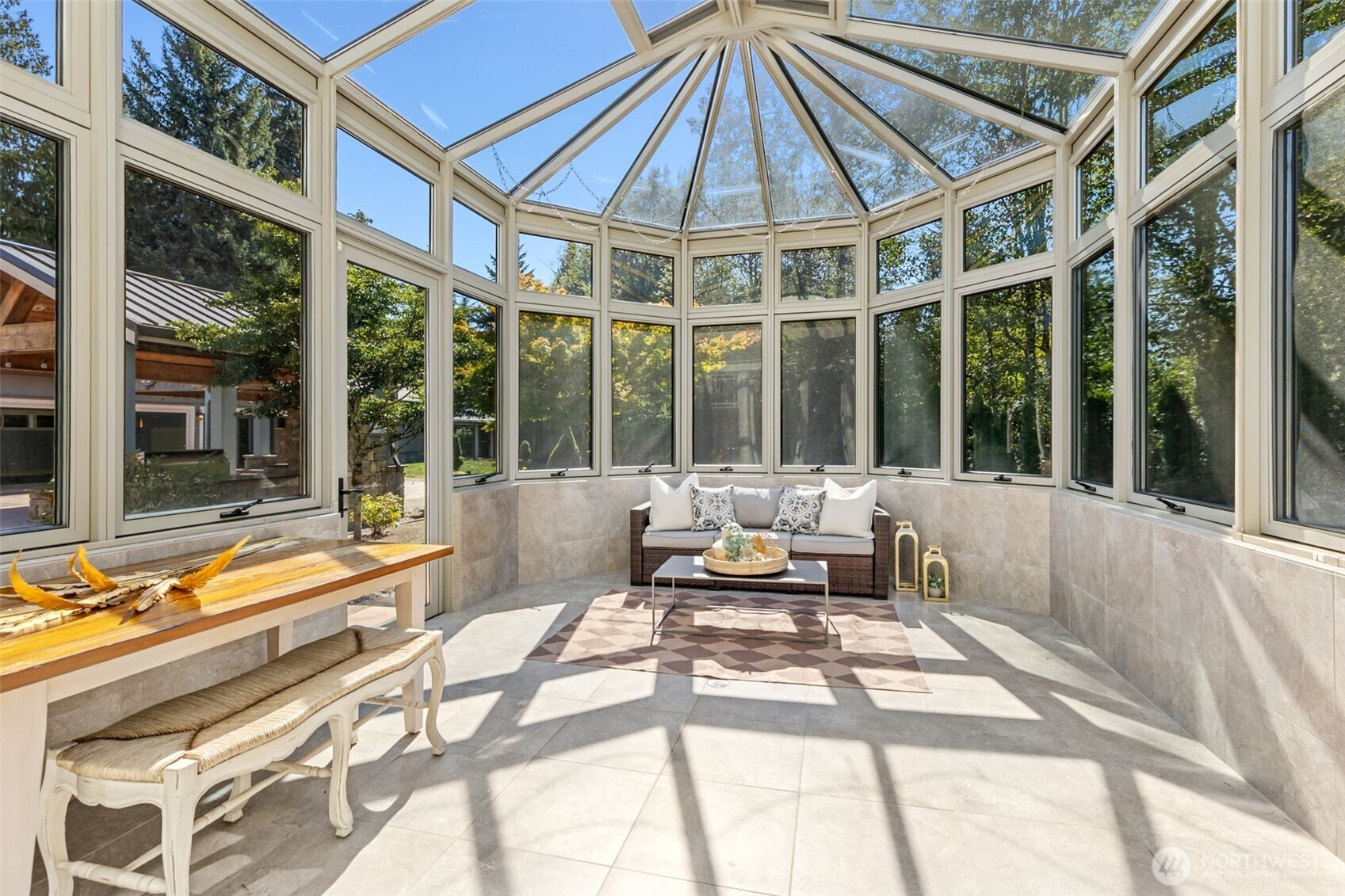 22029 238th Place Southeast Maple Valley, WA 98038 - Photo 14 of 40 a view of a patio with a table and chairs under an umbrella