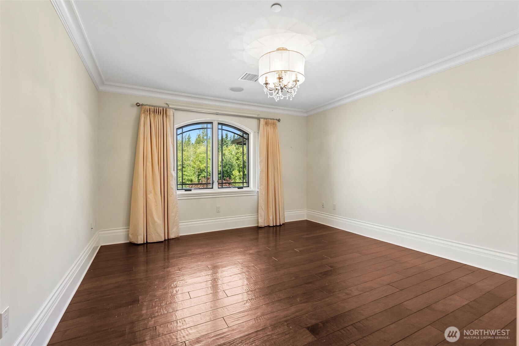 22029 238th Place Southeast Maple Valley, WA 98038 - Photo 32 of 40 an empty room with wooden floor and windows