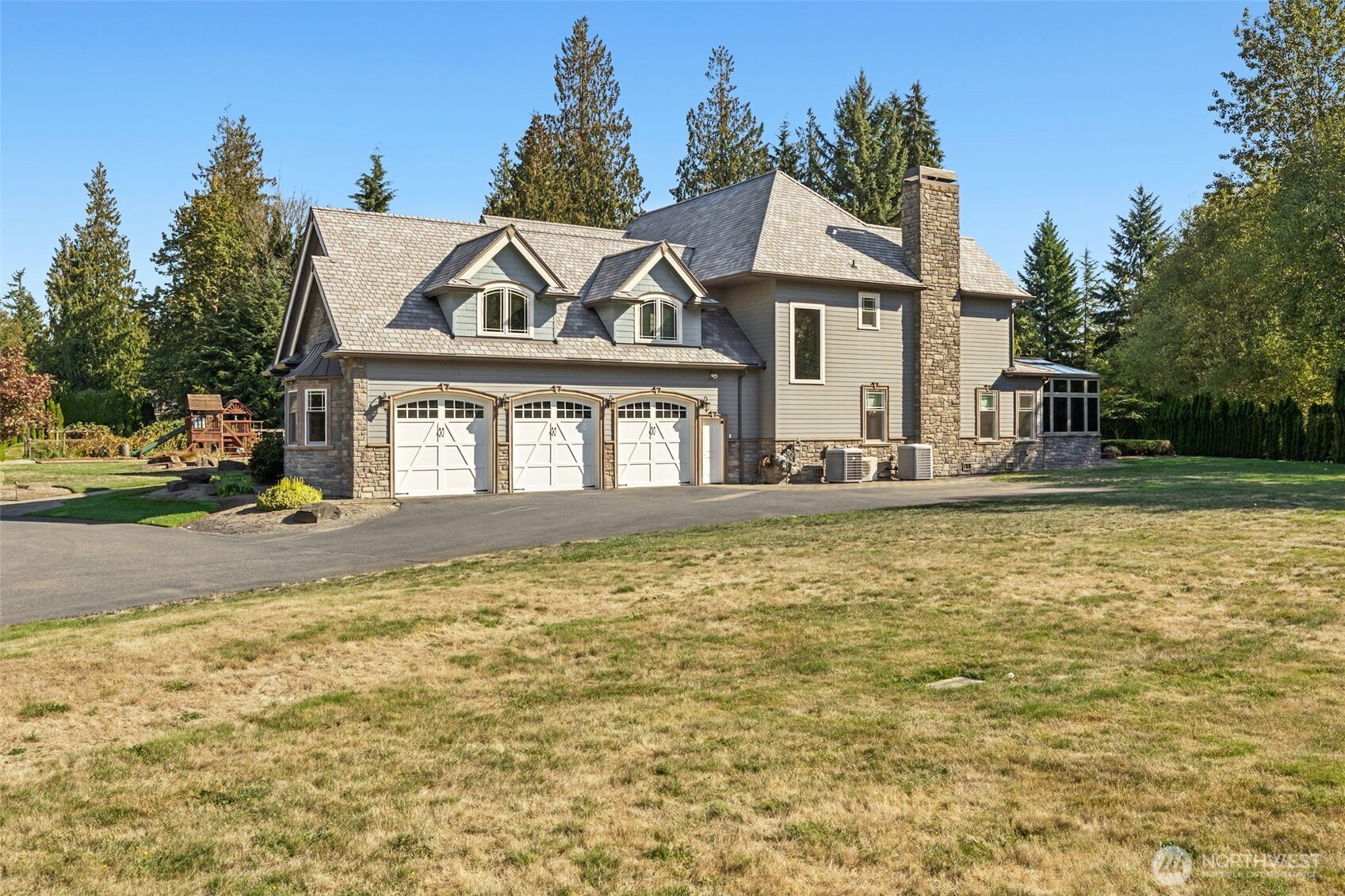 22029 238th Place Southeast Maple Valley, WA 98038 - Photo 34 of 40 a front view of a house with garden