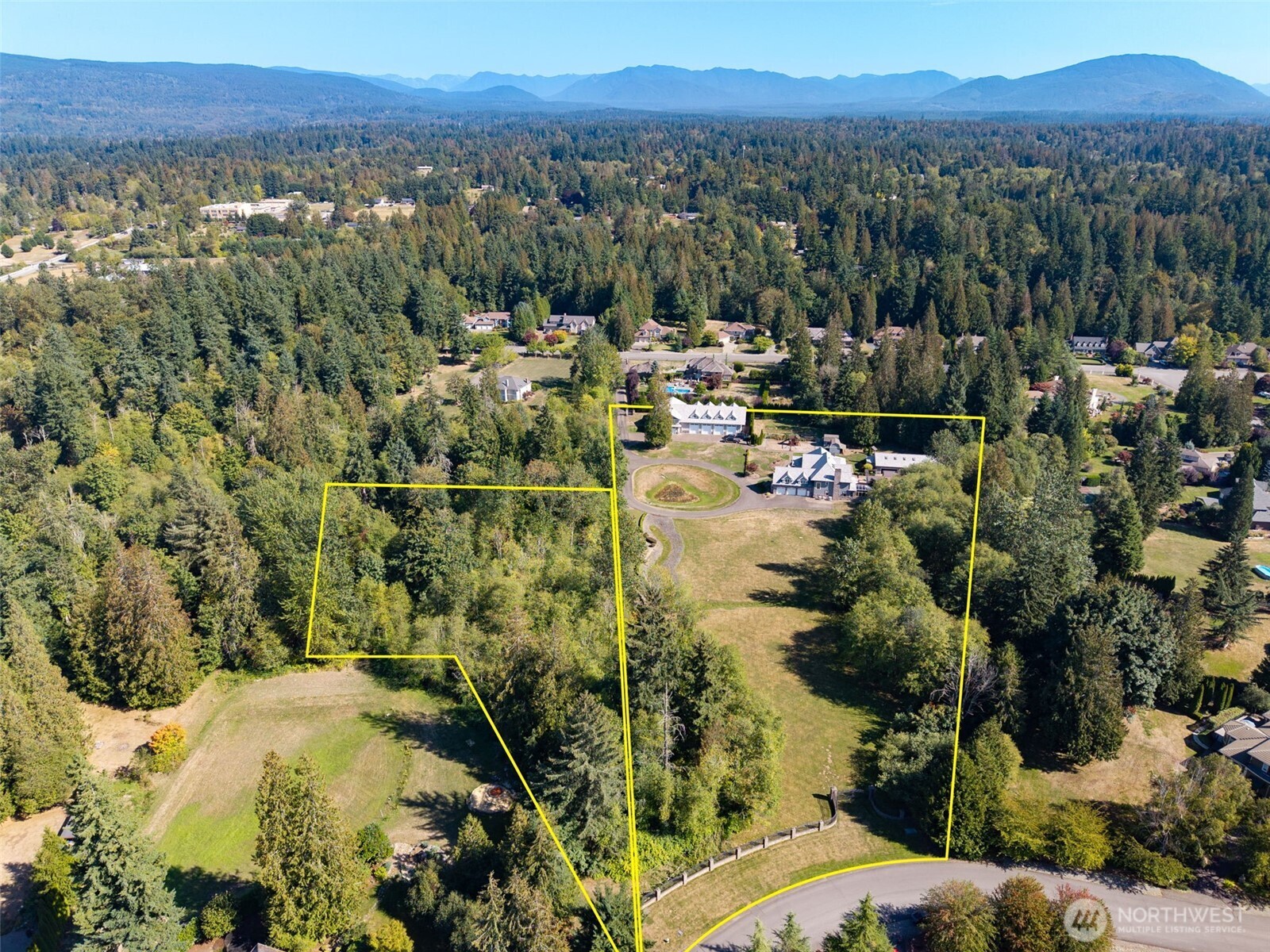 22029 238th Place Southeast Maple Valley, WA 98038 - Photo 38 of 40 a view of a city with mountains in the background