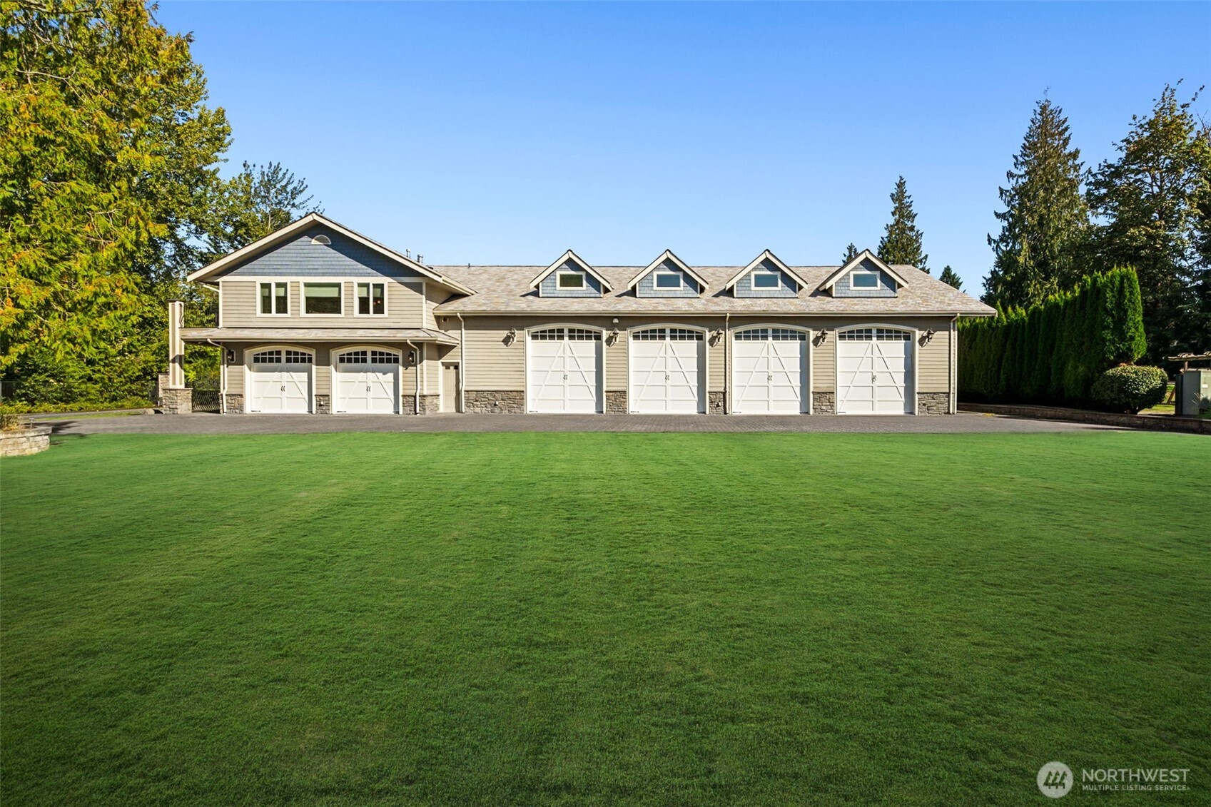 22029 238th Place Southeast Maple Valley, WA 98038 - Photo 4 of 40 a view of a house with a yard and deck