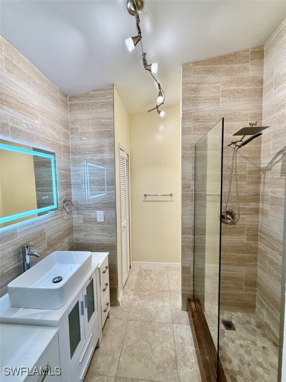 5013 Southwest 16th Place Cape Coral, FL 33914 - Photo 14 of 50 a bathroom with a sink a mirror and shower