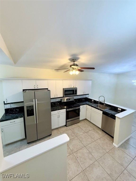 5013 Southwest 16th Place Cape Coral, FL 33914 - Photo 17 of 50 a kitchen with stainless steel appliances granite countertop a refrigerator and a sink