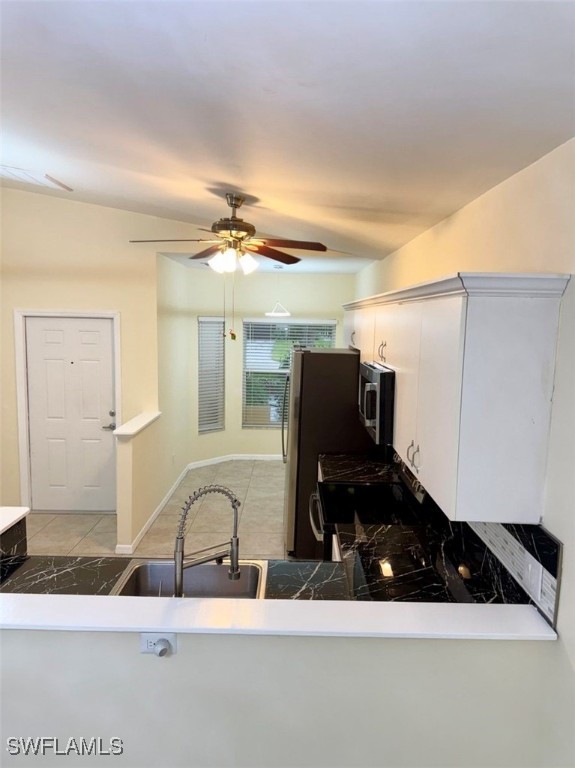 5013 Southwest 16th Place Cape Coral, FL 33914 - Photo 19 of 50 a bathroom with a sink a mirror and vanity