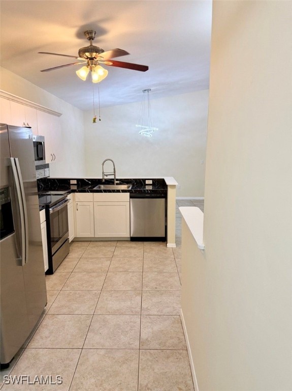 5013 Southwest 16th Place Cape Coral, FL 33914 - Photo 21 of 50 a kitchen with granite countertop a stove a sink and a refrigerator