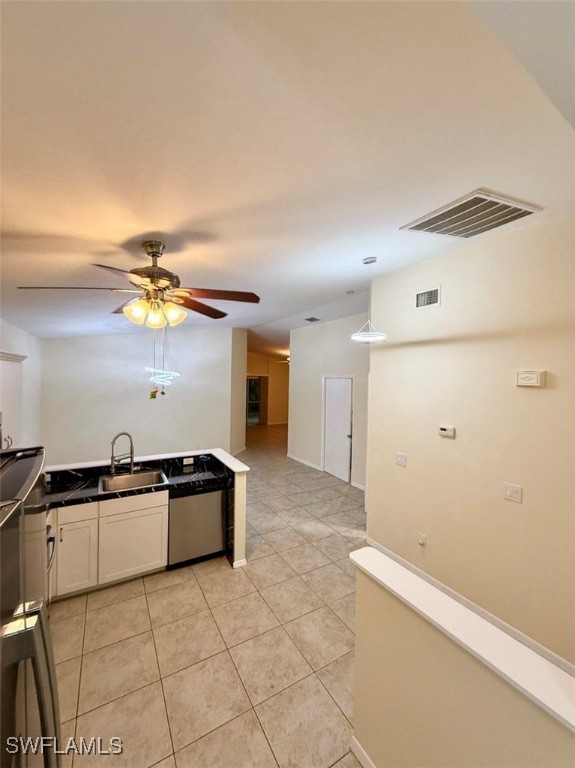5013 Southwest 16th Place Cape Coral, FL 33914 - Photo 22 of 50 a kitchen with kitchen island granite countertop a refrigerator a stove a sink and dishwasher