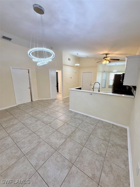 5013 Southwest 16th Place Cape Coral, FL 33914 - Photo 25 of 50 a view of a kitchen with a sink and chandelier
