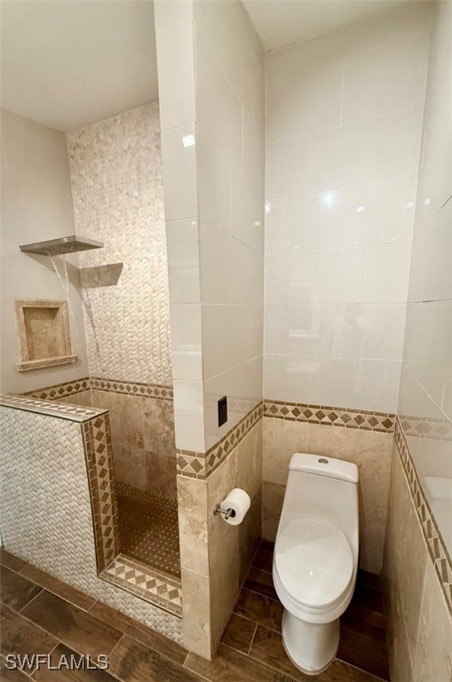 5013 Southwest 16th Place Cape Coral, FL 33914 - Photo 34 of 50 a bathroom with a granite countertop toilet a sink and shower
