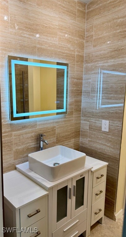 5013 Southwest 16th Place Cape Coral, FL 33914 - Photo 4 of 50 a bathroom with a sink and a mirror