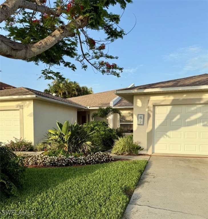 5013 Southwest 16th Place Cape Coral, FL 33914 - Photo 48 of 50 a front view of a house with a garden