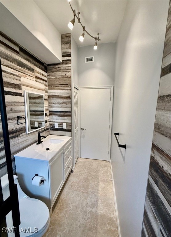 5013 Southwest 16th Place Cape Coral, FL 33914 - Photo 7 of 50 a bathroom with a sink a mirror and a toilet