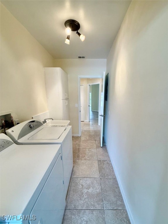 5013 Southwest 16th Place Cape Coral, FL 33914 - Photo 8 of 50 a view of a bathroom with a sink and mirror