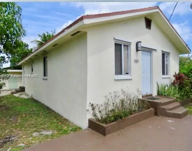a front view of a house with yard