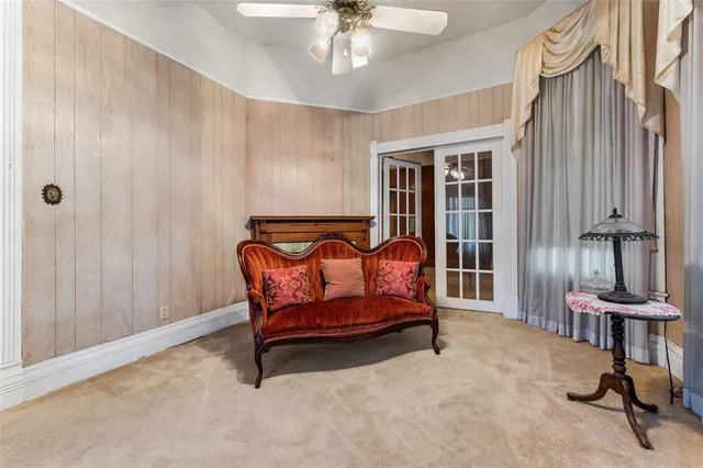 a bedroom with furniture and a window