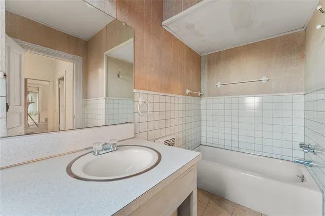 a bathroom with a sink and a bathtub