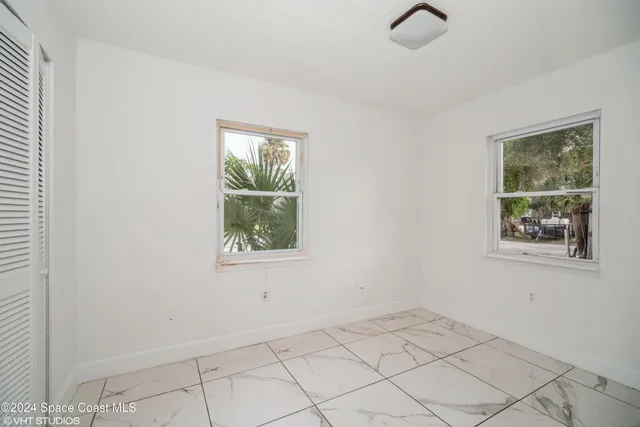 an empty room with windows