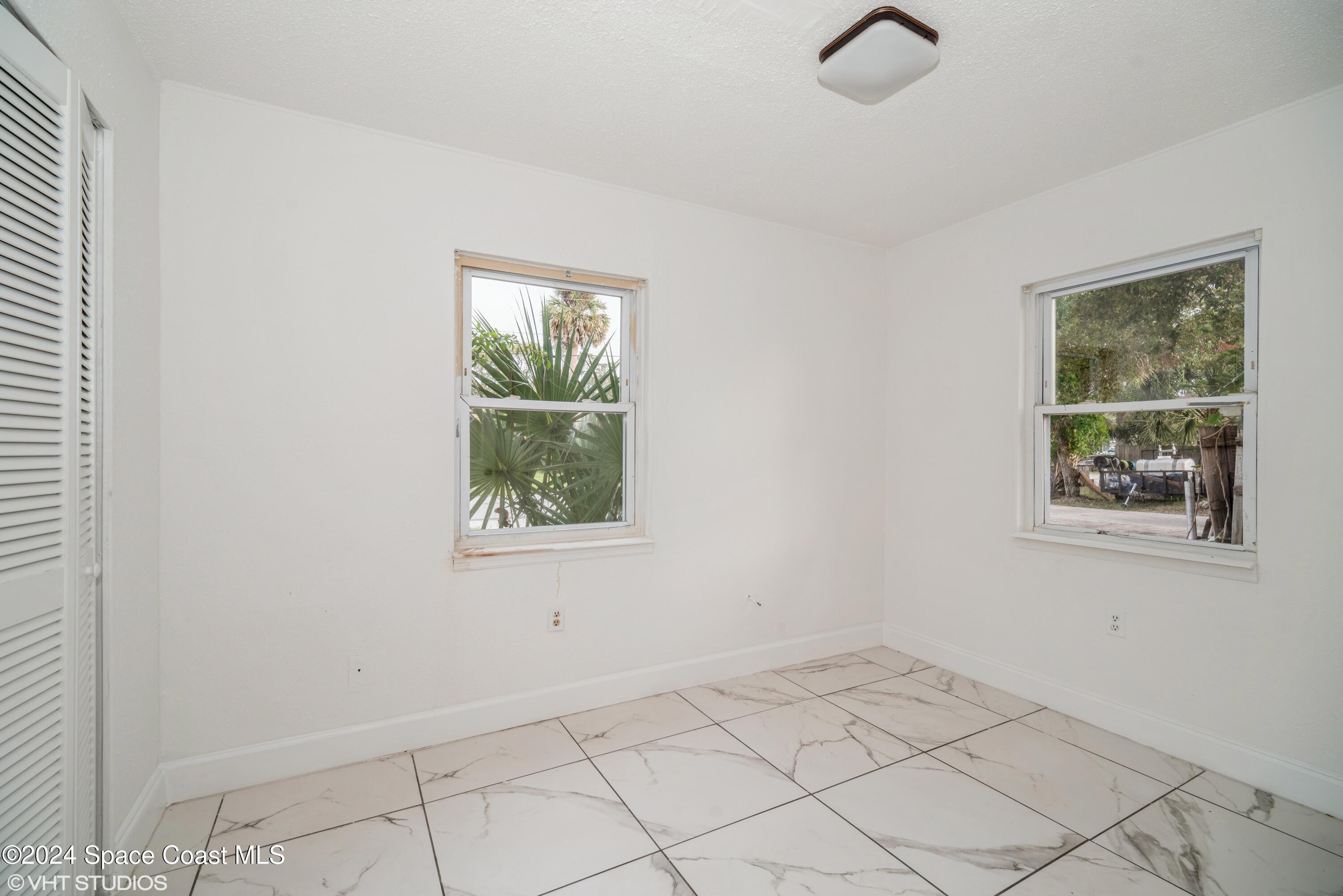 2154 Henry Street Northeast Palm Bay, FL 32905 - Photo 13 of 20 13_2154HenryStNE_153_2ndBedroom_HiRes