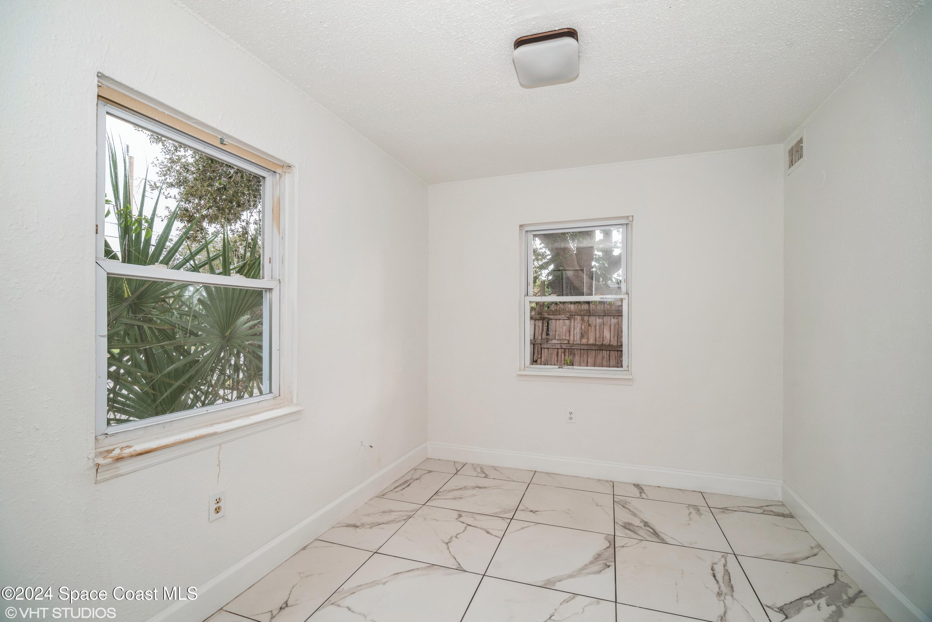 2154 Henry Street Northeast Palm Bay, FL 32905 - Photo 14 of 20 14_2154HenryStNE_153001_2ndBedroom_HiRes