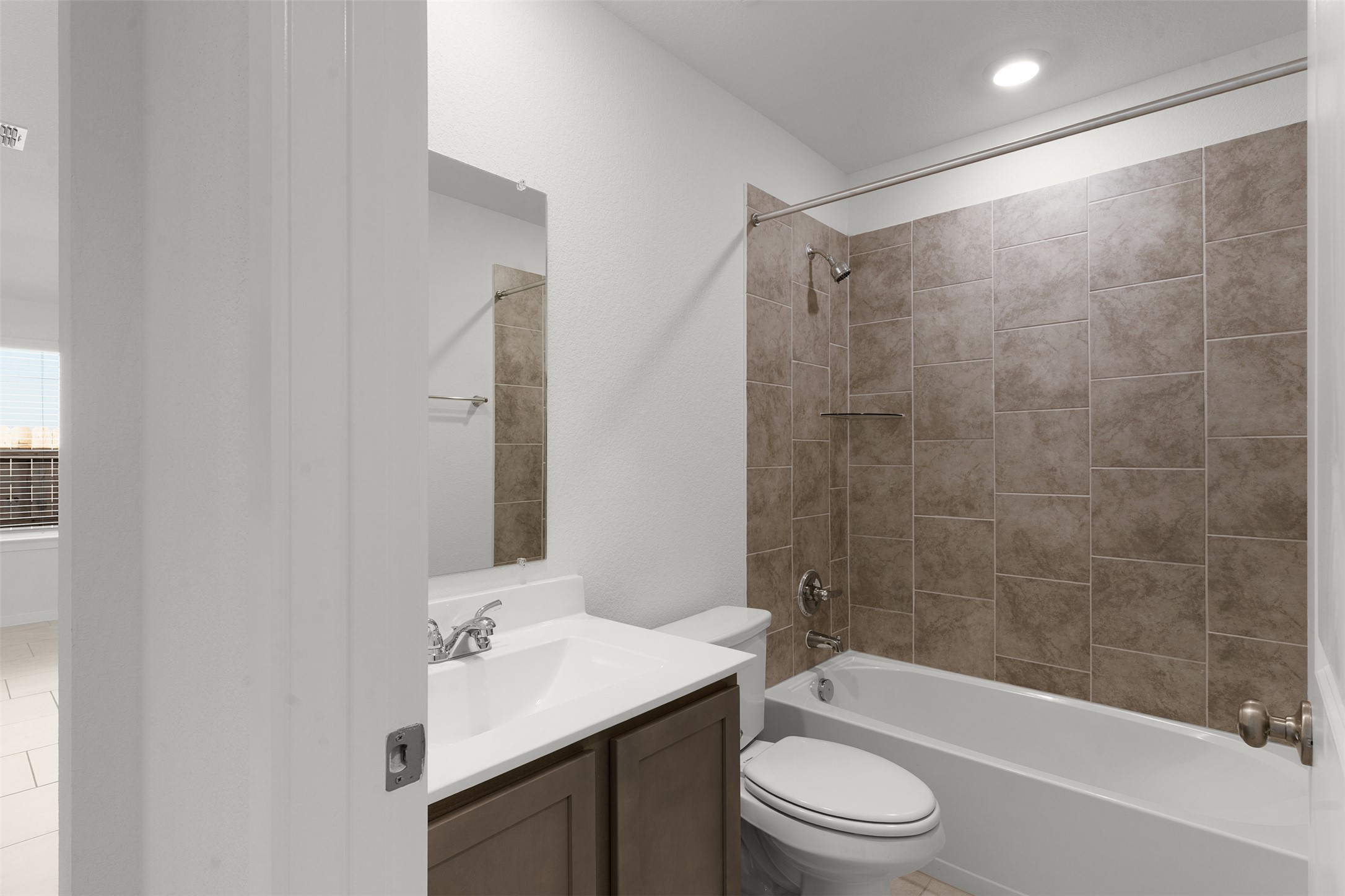 13832 Scarlett Song Drive Elgin, TX 78621 - Photo 15 of 26 Full bath with vanity and bathtub / shower combination
