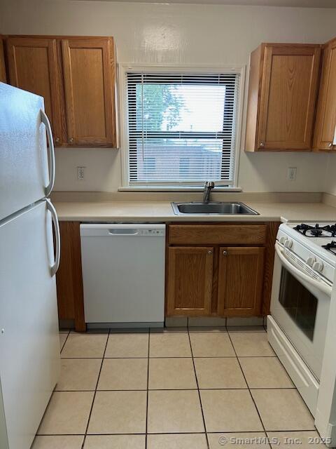 34 Prospect Street, Unit 4H Norwalk, CT 06850 - Photo 3 of 8 a kitchen with stainless steel appliances granite countertop a stove a sink and a microwave