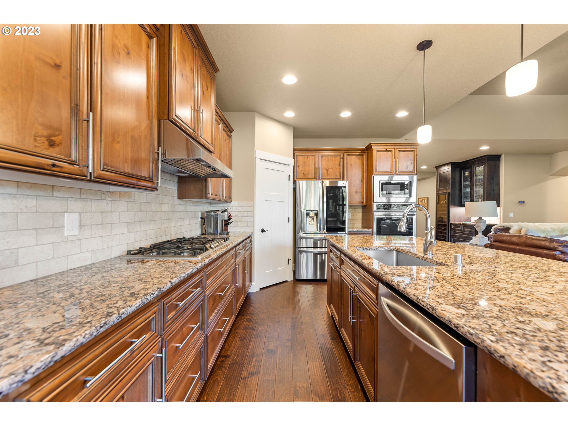 1845 South Harrier Road Ridgefield, WA 98642 - Photo 11 of 28 a large kitchen with granite countertop lots of counter top space and stainless steel appliances