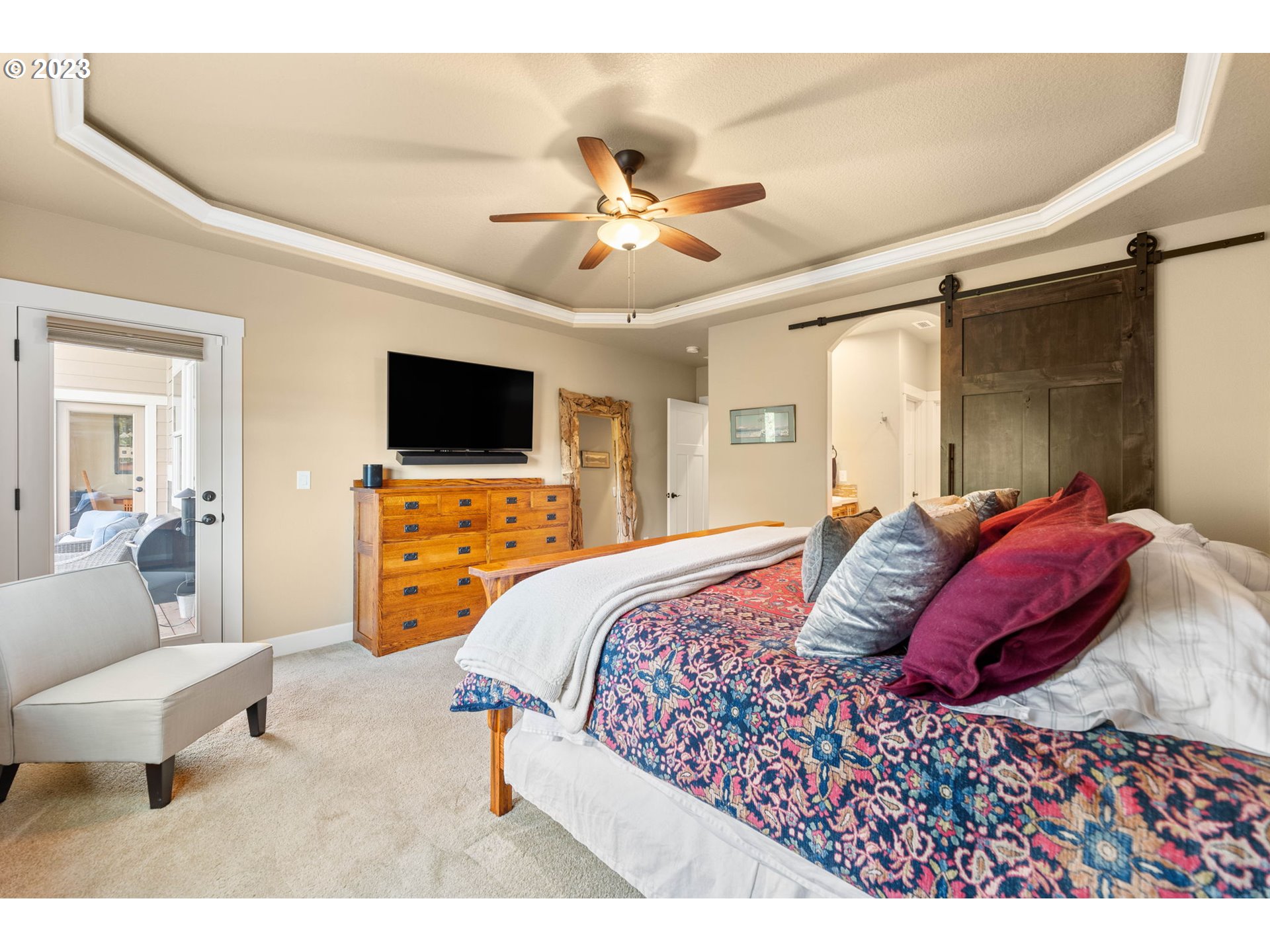 1845 South Harrier Road Ridgefield, WA 98642 - Photo 18 of 28 a bedroom with a bed and a flat screen tv