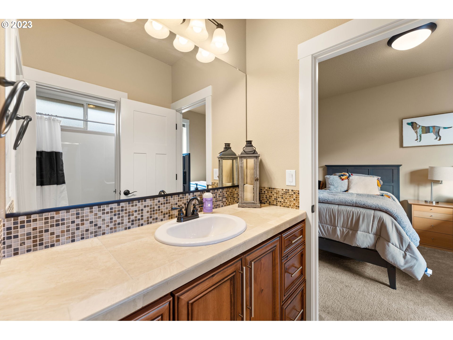 1845 South Harrier Road Ridgefield, WA 98642 - Photo 23 of 28 a en suite bathroom with a double vanity sink and a mirror