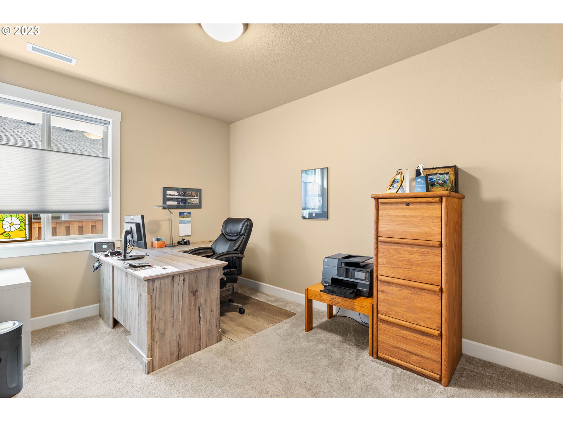 1845 South Harrier Road Ridgefield, WA 98642 - Photo 24 of 28 a view of a workspace with furniture and a window
