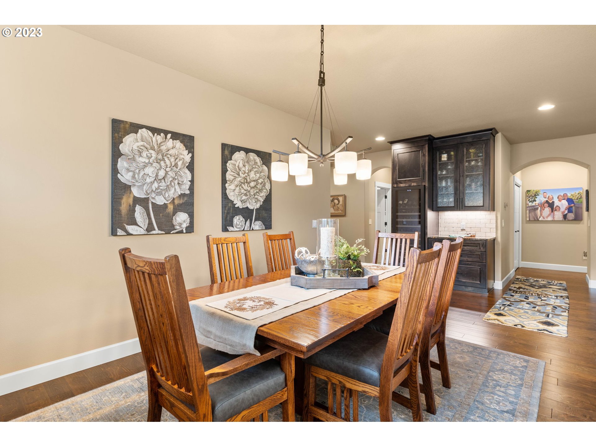 1845 South Harrier Road Ridgefield, WA 98642 - Photo 7 of 28 a dining room with furniture a chandelier and wooden floor