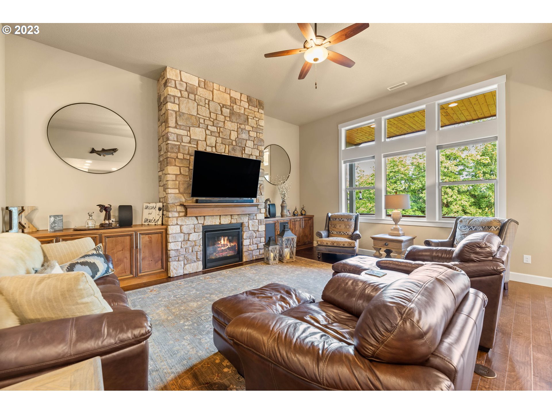 1845 South Harrier Road Ridgefield, WA 98642 - Photo 8 of 28 a living room with furniture a fireplace and a flat screen tv
