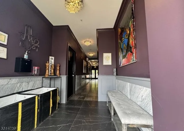 a hallway with washer and dryer