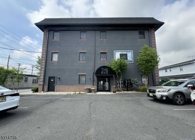 a view of a car parked in front of a building